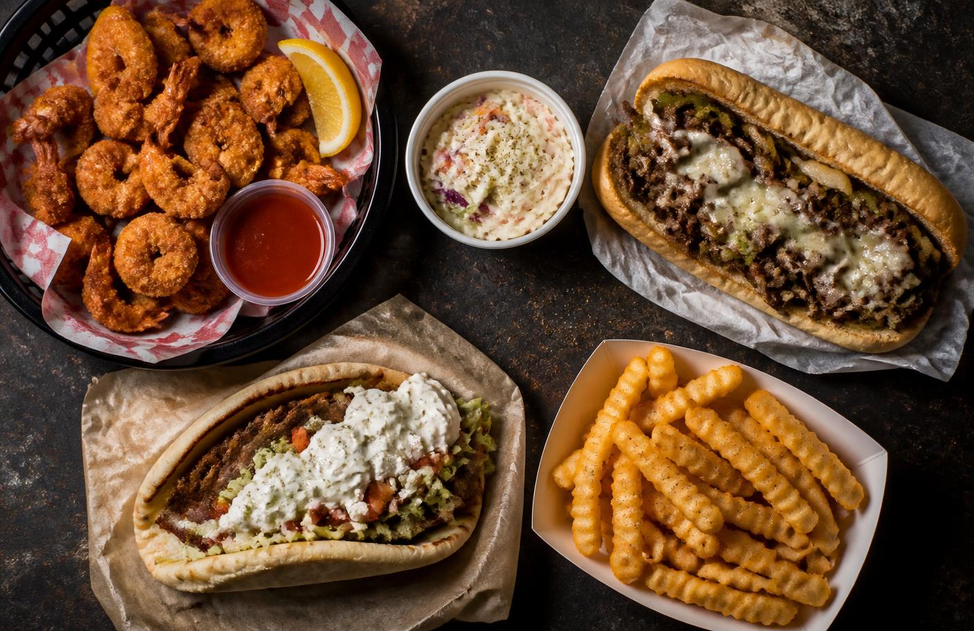 Fried shrimp basket, Philly cheesesteak, gyro, coleslaw and crinkle fries